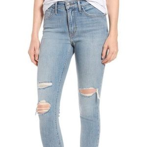 Levi’s 721 light wash ripped high rise skinny jeans